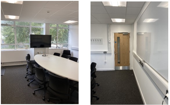 Collaboration Table with Chairs in center of room.